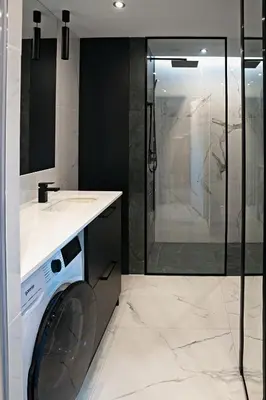 a washing machine in a bathroom with a shower at UR4N Apartment - Heltmana in Kraków