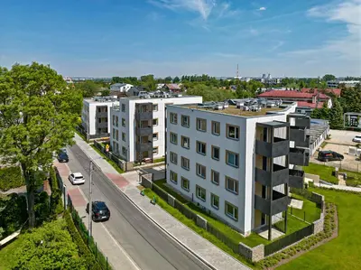an overhead view of a white building on a street at UR4N Apartment - Heltmana in Kraków