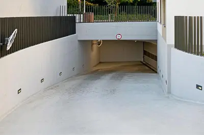 an empty parking lot with a ramp in a building at UR4N Apartment - Heltmana in Kraków