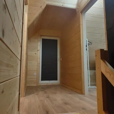 a room with a window in a wooden house at beskid.house2 in Spytkowice
