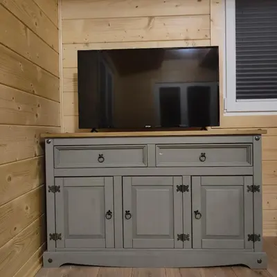 a television on top of a dresser in a room at beskid.house2 in Spytkowice