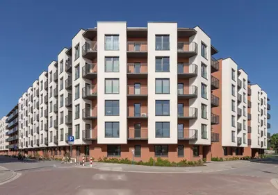 a large apartment building on the side of a street at Crystal Luxury Apartment with Free Parking in Cracow for 4 Guests in Kraków