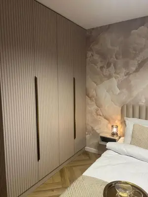 a bedroom with a bed and a wall mural at Crystal Luxury Apartment with Free Parking in Cracow for 4 Guests in Kraków