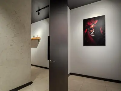 a room with a painting on the wall and a door at Loft vistula old town apartament free parking in Kraków