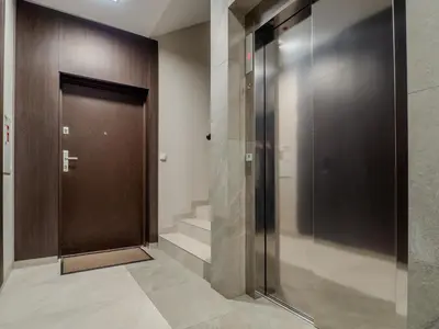 a elevator in a building with a door and stairs at Loft vistula old town apartament free parking in Kraków