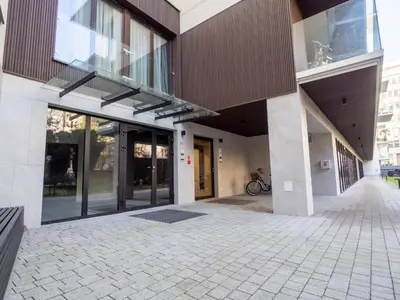 an external view of a building with glass doors at Loft vistula old town apartament free parking in Kraków