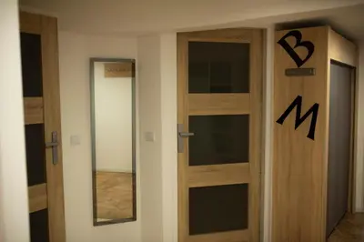 a door in a room with two glass doors at Apartament 33 Skawina in Skawina