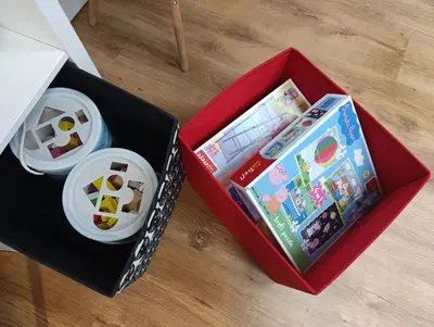 two boxes with toys in them on a table at Apartament 33 Skawina in Skawina