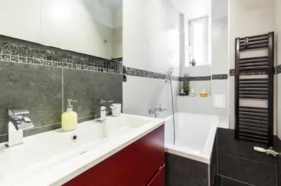 a bathroom with a sink and a tub and a shower at Apartament przy Wawelu 80 m2 6 osób Kazimierz in Kraków