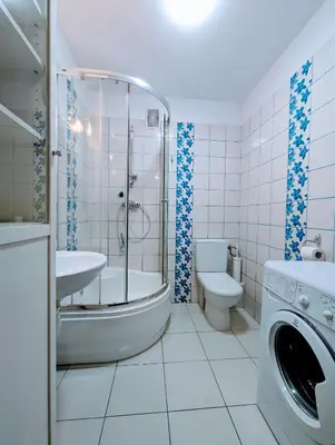 a bathroom with a tub and a sink and a toilet at Karłowicza 12 by Homeprime in Kraków