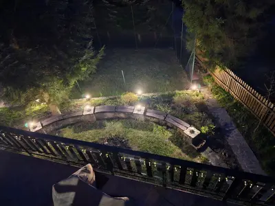 a fence in front of a yard with trees at willa Partykówka in Poręba Wielka
