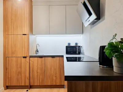 a kitchen with a sink and a microwave at Cozy Studio for couples - Cracow city heart in Kraków
