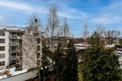 an aerial view of a city with trees and buildings at Park Białoprądnicki Blue Studio by BookingHost in Kraków