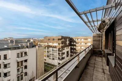 an apartment balcony with a view of buildings at Lea Cosy Apartment by BookingHost in Kraków