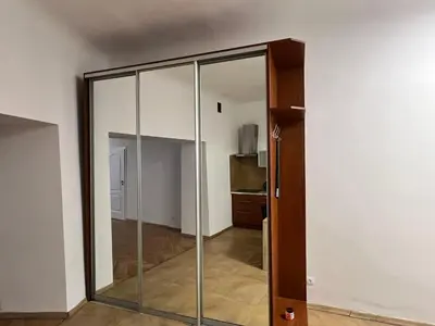 a sliding glass door in a room with at Apartament rodzinny 14 in Kraków