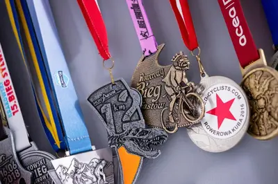 a bunch of medals are hanging on a table at Apartments Cracow Czeczow by Noclegi Renters in Kraków