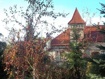 a large building with a red roof at Dwór w Boleniu in Bolen