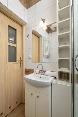 a bathroom with a sink and a mirror at Pet-Friendly & Cozy Studio in Kraków by Noclegi Renters in Kraków