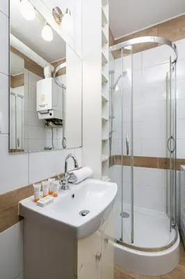 a bathroom with a sink and a shower at Pet-Friendly & Cozy Studio in Kraków by Noclegi Renters in Kraków