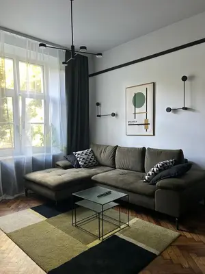 a living room with a couch and a table at Composition No. 2 in Kraków