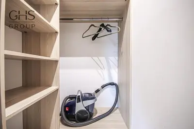 a vacuum cleaner is sitting in a closet at Ekskluzywny Apartament obok Zamku Wawelskiego in Kraków