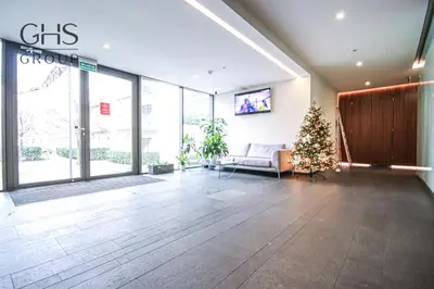 a lobby with a christmas tree in a building at Ekskluzywny Apartament obok Zamku Wawelskiego in Kraków