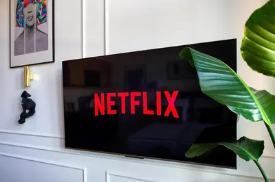 a flat screen tv sitting on a white wall at Discover Krakow Apartments - Lubomirskiego St - Classic & Modern - Near Main Station, Netflix and AC in Kraków
