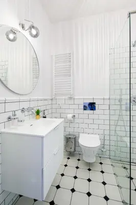 a white bathroom with a sink and a toilet at Discover Krakow Apartments - Lubomirskiego St - Classic & Modern - Near Main Station, Netflix and AC in Kraków