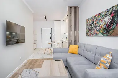a living room with a couch and a table at Golden residence apartment in Kraków