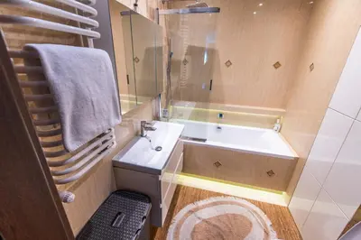 a bathroom with a sink and a bath tub at LARGE LUXURY APARTMENT WIELICZKA in Wieliczka