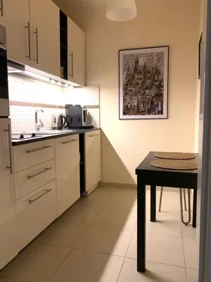a small kitchen with a table and a tableablish at Apartament S19 in Kraków