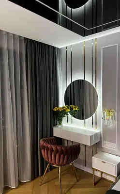 a living room with a table and a mirror at Paris in Cracow Apartment in Kraków