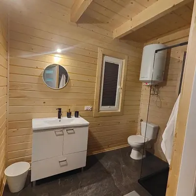 a bathroom with a sink and a toilet at beskid.house1 in Spytkowice