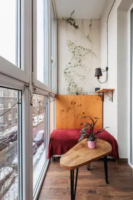 a room with a bed and a table with a potted plant at Luminous Loft - Modern Old Town Apartment - by Upstairs in Kraków