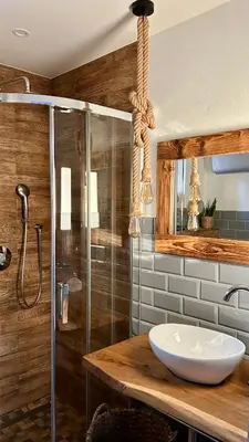 a bathroom with a sink and a shower at Domek Babiogórski z JACUZZI in Zubrzyca Górna