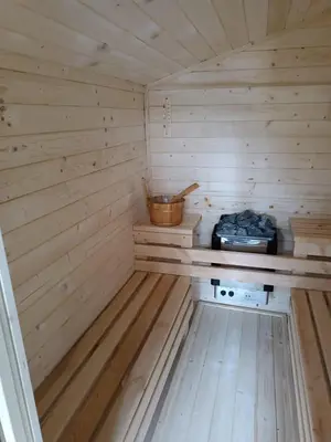 a small wooden sauna with a stove in it at Domek Parzenica Nowy Targ in Nowy Targ