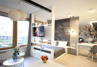 a bedroom with a bed and a desk and a tv at VIVA LILA Apartment, FREE PARKING, close to Vistula River - by Homelike Krakow in Kraków