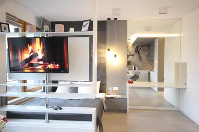 a living room with a tv and a fireplace at VIVA LILA Apartment, FREE PARKING, close to Vistula River - by Homelike Krakow in Kraków