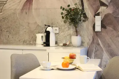 a table with a plate of fruit on it at VIVA LILA Apartment, FREE PARKING, close to Vistula River - by Homelike Krakow in Kraków