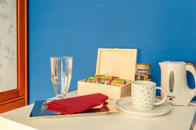 a table topped with a plate and a glass at Botaniczny Pokój in Kraków