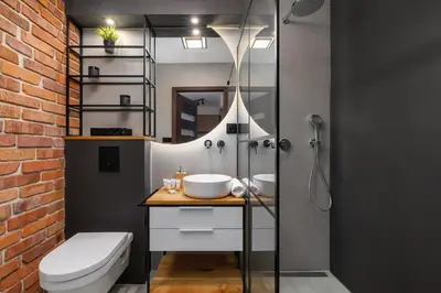 a bathroom with a shower and a toilet and a sink at Near EXPO Cracow Elegant Apartment by Noclegi Renters in Kraków