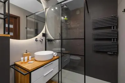 a bathroom with a sink and a shower at Near EXPO Cracow Elegant Apartment by Noclegi Renters in Kraków