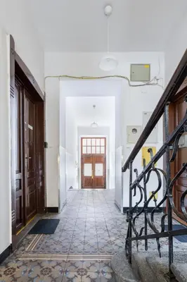 an empty hallway with a staircase and a door at Wonderful Apartments in the Center of Krakow in Kraków