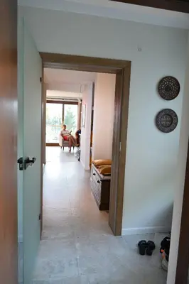 a hallway with a person sitting in a chair in a room at Chatka Beatki in Stryszawa