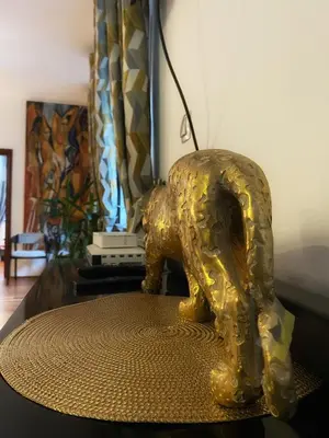 a gold elephant statue sitting on top of a table at Apartament w centrum Brzeska 1 in Brzesko