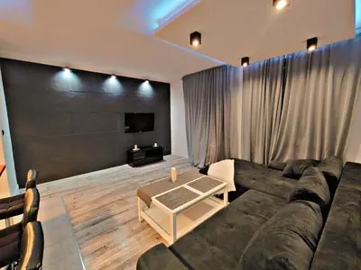 a living room with a couch and a table at Szlak Apartment Old Town in Kraków