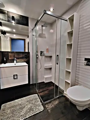 a bathroom with a shower and a toilet and a sink at Szlak Apartment Old Town in Kraków
