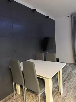 a white table and chairs in a room at Szlak Apartment Old Town in Kraków