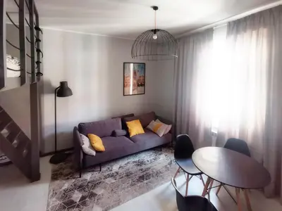 a living room with a couch and a table at Komfort w sercu Kazimierza in Kraków
