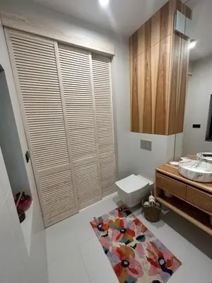 a bathroom with a toilet and a sink at BM Apartments - parter domu z tarasem in Kraków